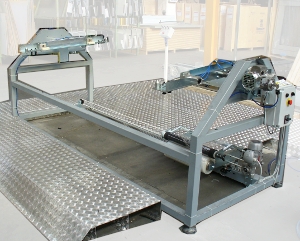 Solaut produces stretch film wrapping machines for doors that also perform the function of assembly bench